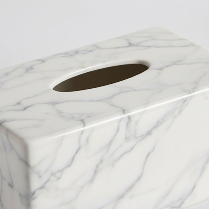 Close-up of marble ceramic surface showing fine gray veining and glazed finish