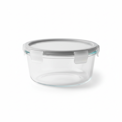 Round glass food storage container with airtight lid on white background