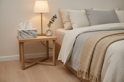 Marble ceramic tissue cover on bedside table in modern bedroom with tissue pulled out